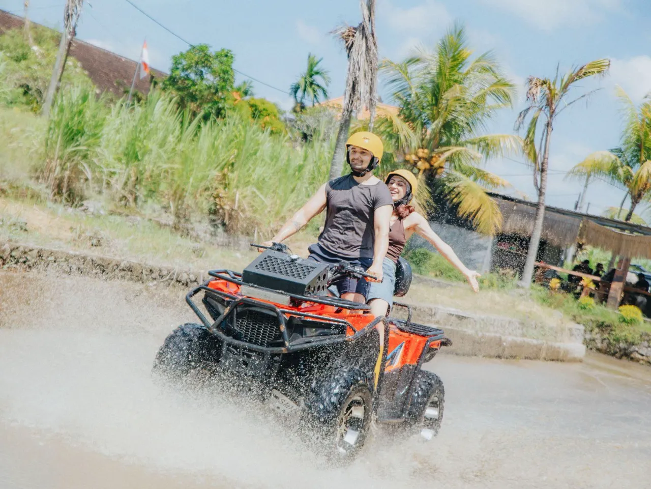 Couple enjoying ATV quad bike during Bali honeymoon